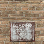 Loading zone sign. Photo by Jen Theodore on Unsplash