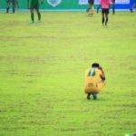 football player after missing goal